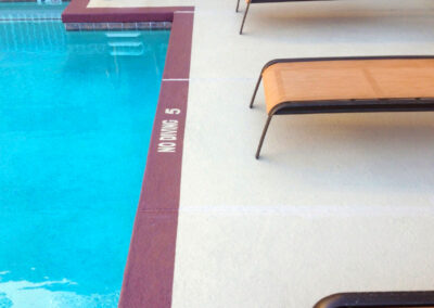 hotel pool deck resurfacing with knockdown textured concrete overlay for non-slip grip